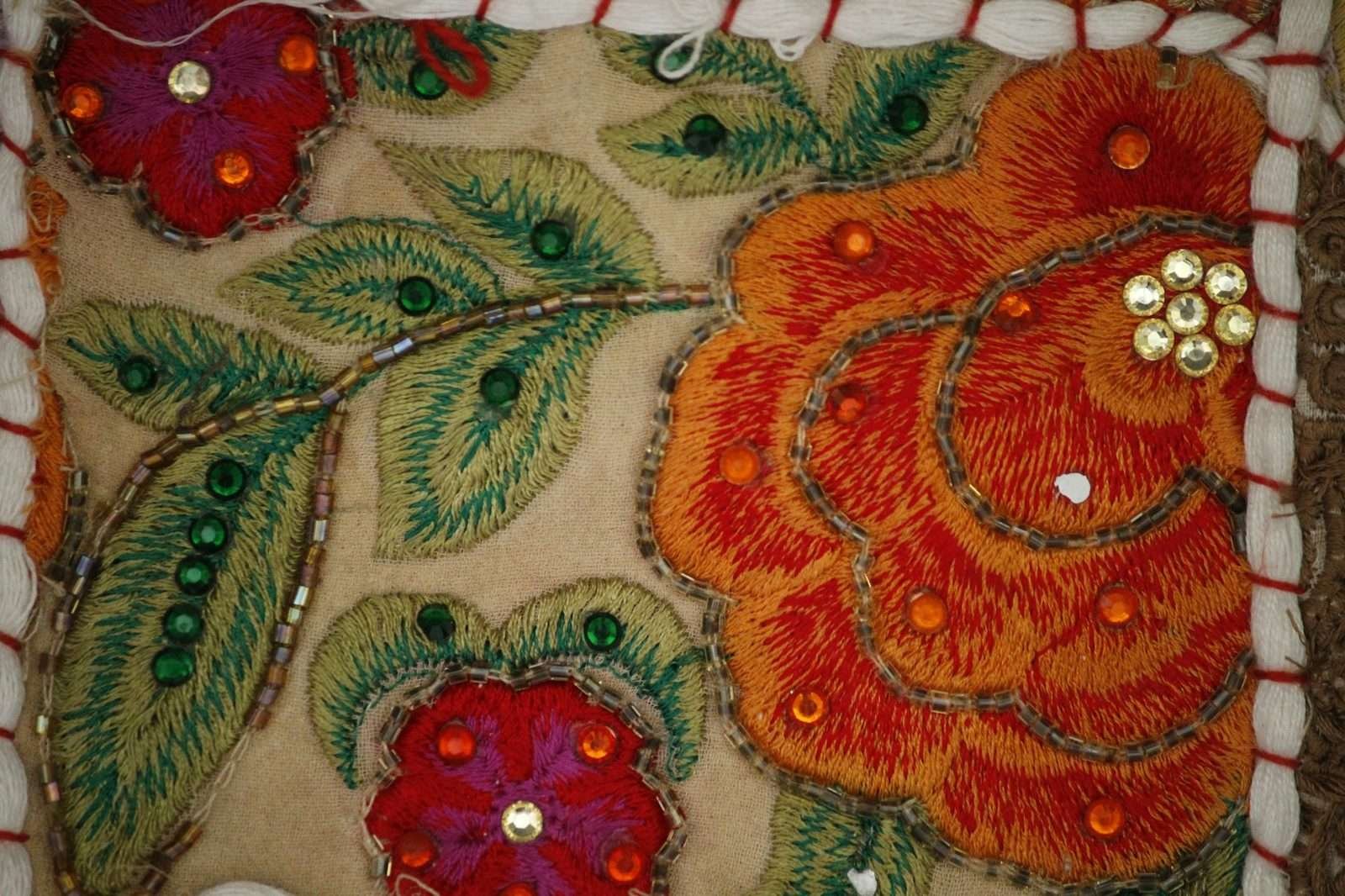 Illustrative image: floral embroidery with sequins on fabric