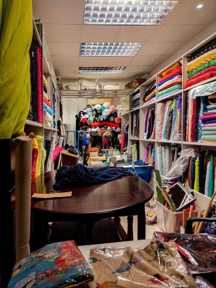 Illustrative image: fabric shop with shelves of colourful textiles