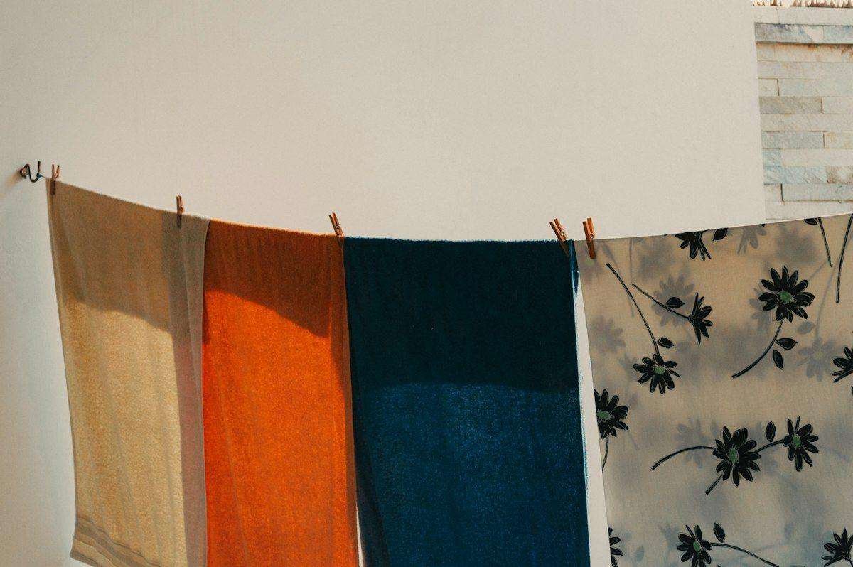 Illustrative image: floral fabrics hanging on a clothesline