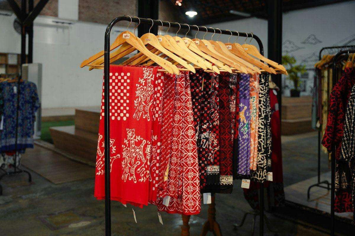 Illustrative image: patterned fabrics hanging on a rack