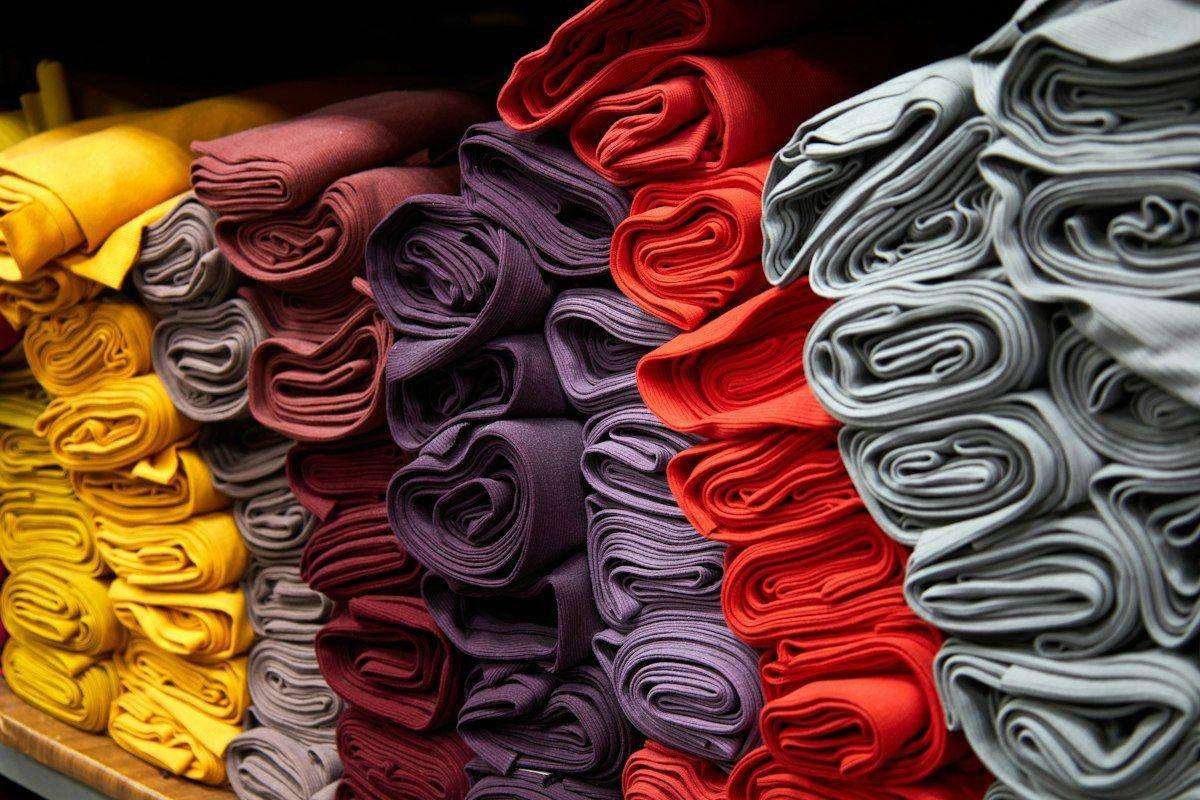 Illustrative image: rolled fabrics in warm colours