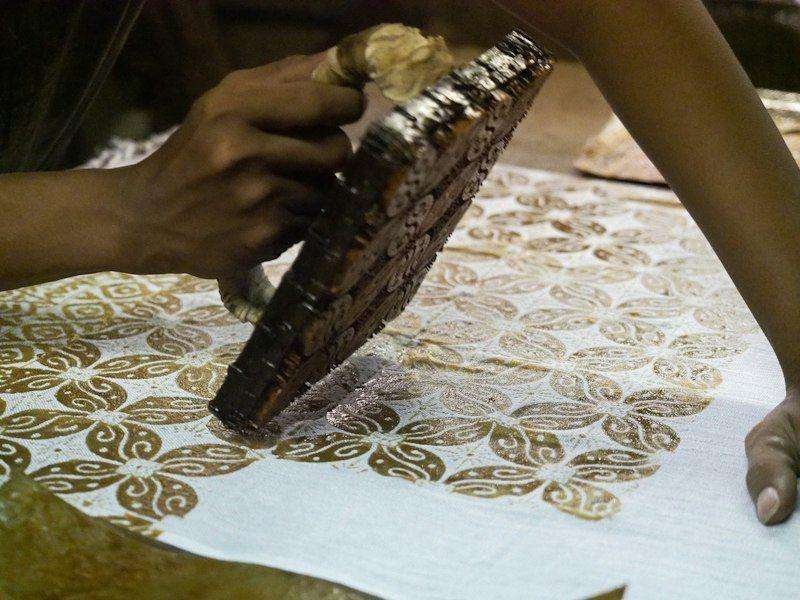 Illustrative image: hand printing fabric with a wooden block