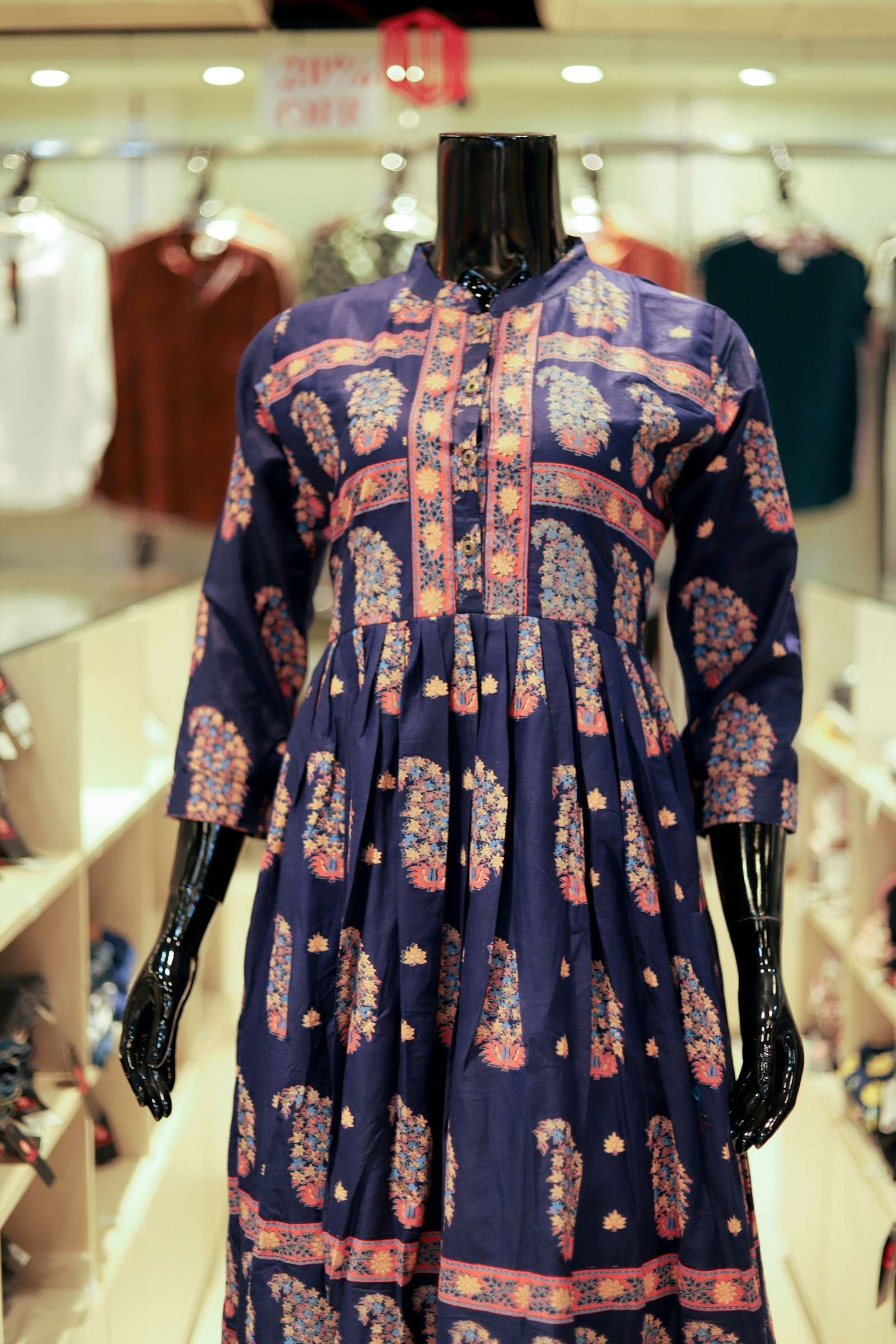 Illustrative image: navy printed cotton kurti with a paisley pattern on a mannequin