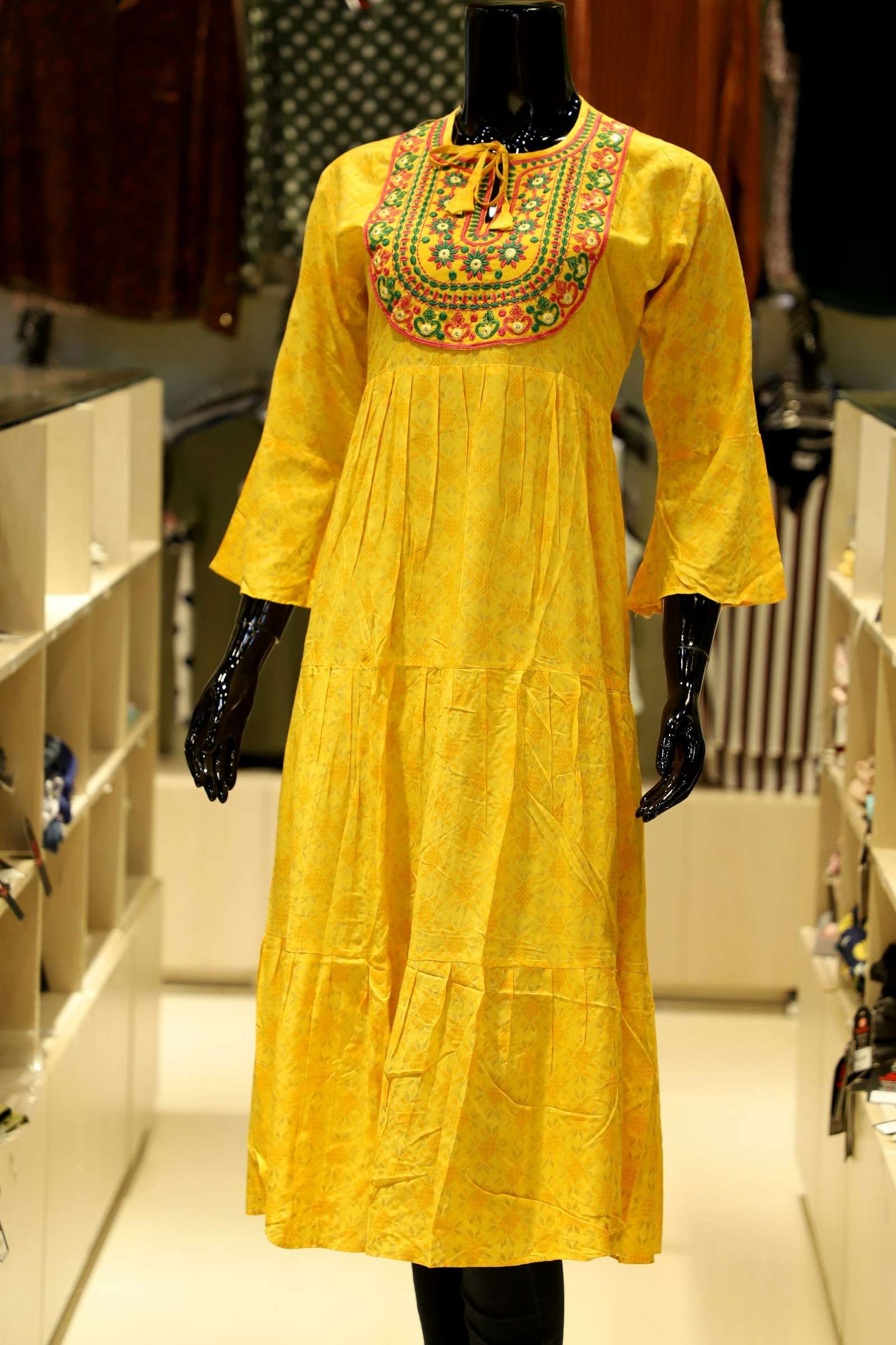 Illustrative image: yellow cotton kurti with an embroidered neckline on a mannequin