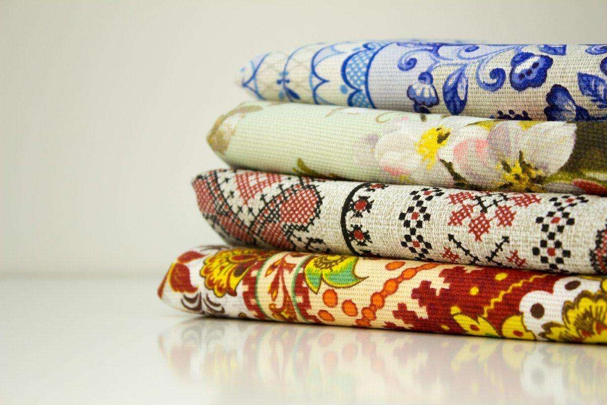 Illustrative image: stack of printed cotton fabrics