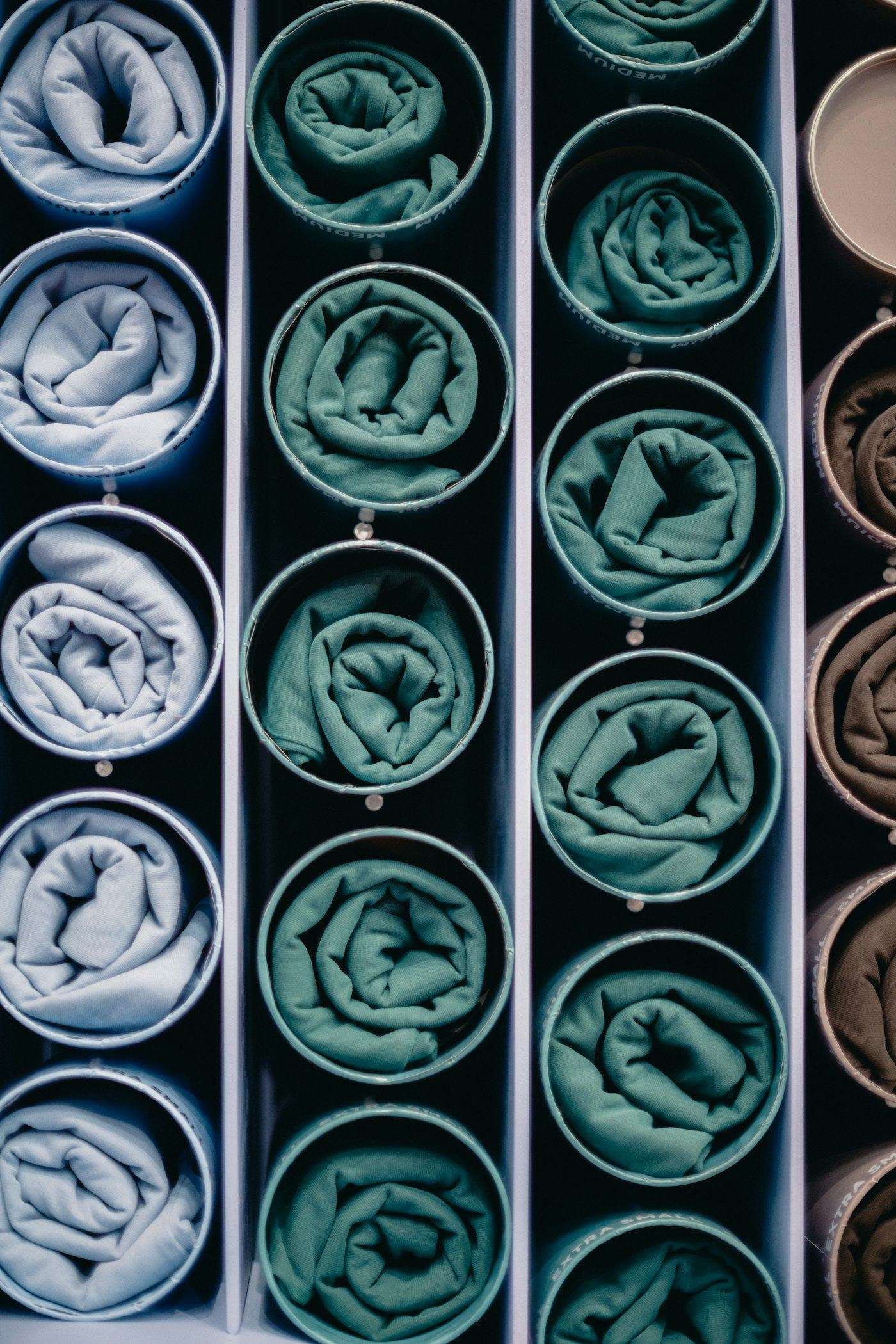 Illustrative image: rolled fabrics stored in round compartments