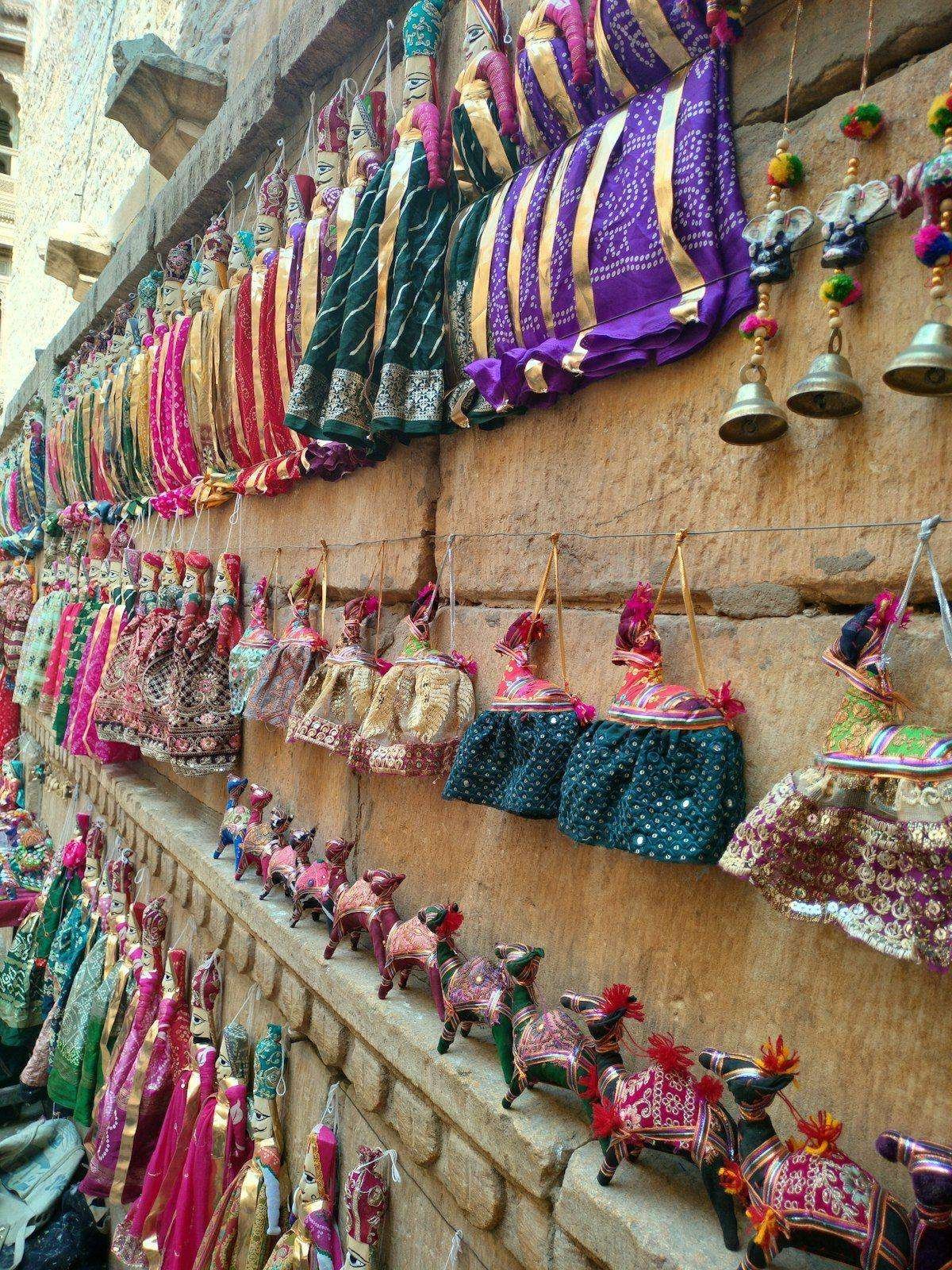 Illustrative image: colourful textiles and crafts displayed on a wall