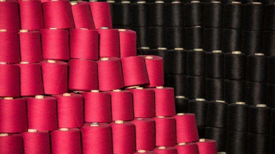 Illustrative image: cones of pink and black thread